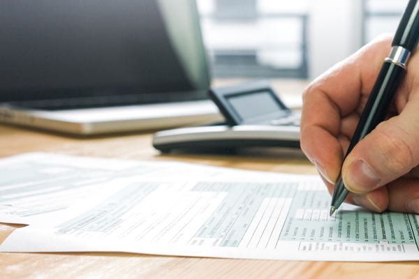 person filling US tax form